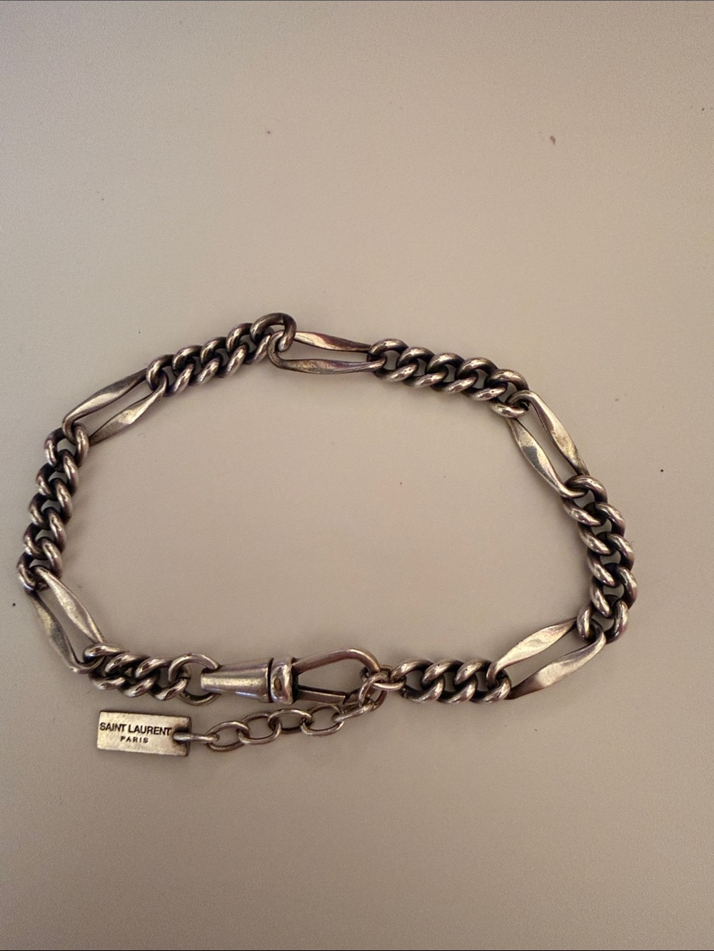 YSL Saint Laurent silver-tone metal Figaro chain bracelet with logo tag